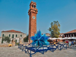 Glass comet and the clock tower on Murano