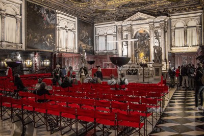 Numerous tourists admire Tintoretto’s master work in Great School of San Rocco in Venice-Italy